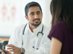 doctors talking to patient
